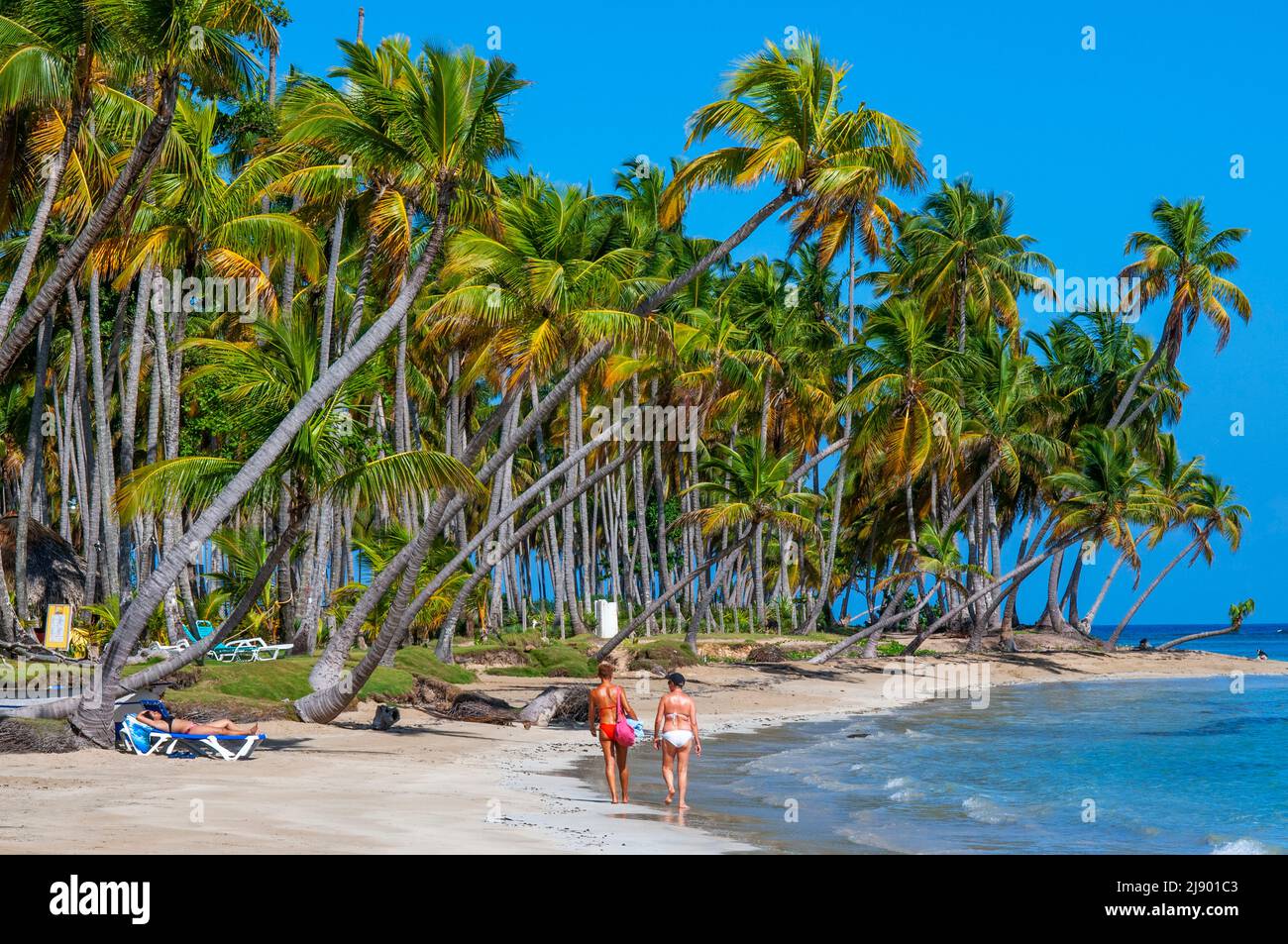 Tourists girls in playa bonita beach on the Samana peninsula in Dominican Republic near the Las Terrenas town.   Playa Bonita, as its name suggests, i Stock Photo