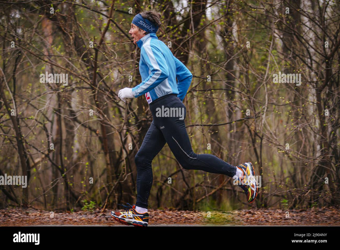 Chelyabinsk, Russia - April 23, 2016: elderly man athlete running race in City marathon Stock Photo