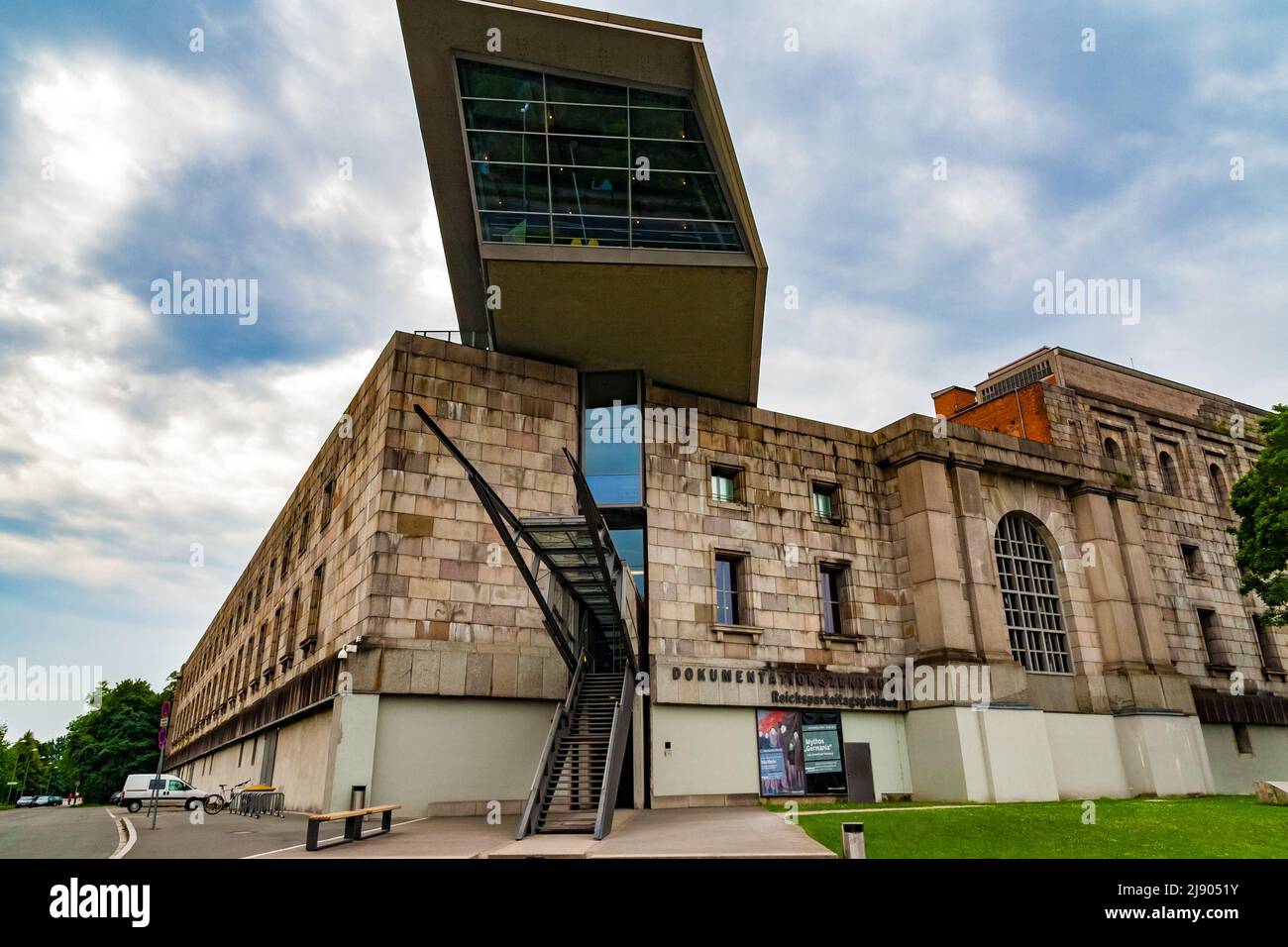 The Documentation Center with its glass and steel like arrow piercing the north wing of the unfinished remains of the Congress Hall of the former Nazi... Stock Photo