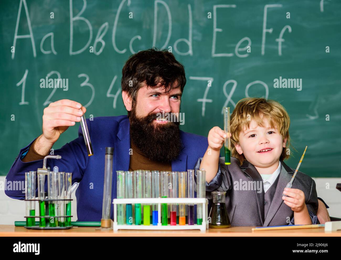 Perseverance pays off. School lesson. Chemical experiment. Symptoms of ADHD at school. Educational school program. Schoolboy cute child experimenting Stock Photo