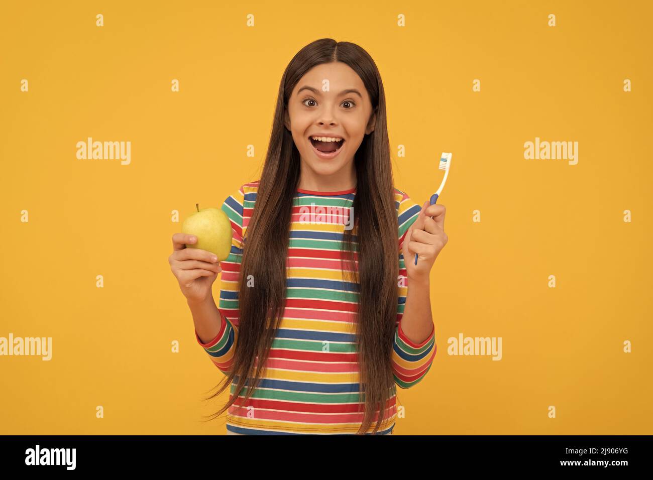 Surprising benefits of oral hygiene. Surprised girl hold tooth brush