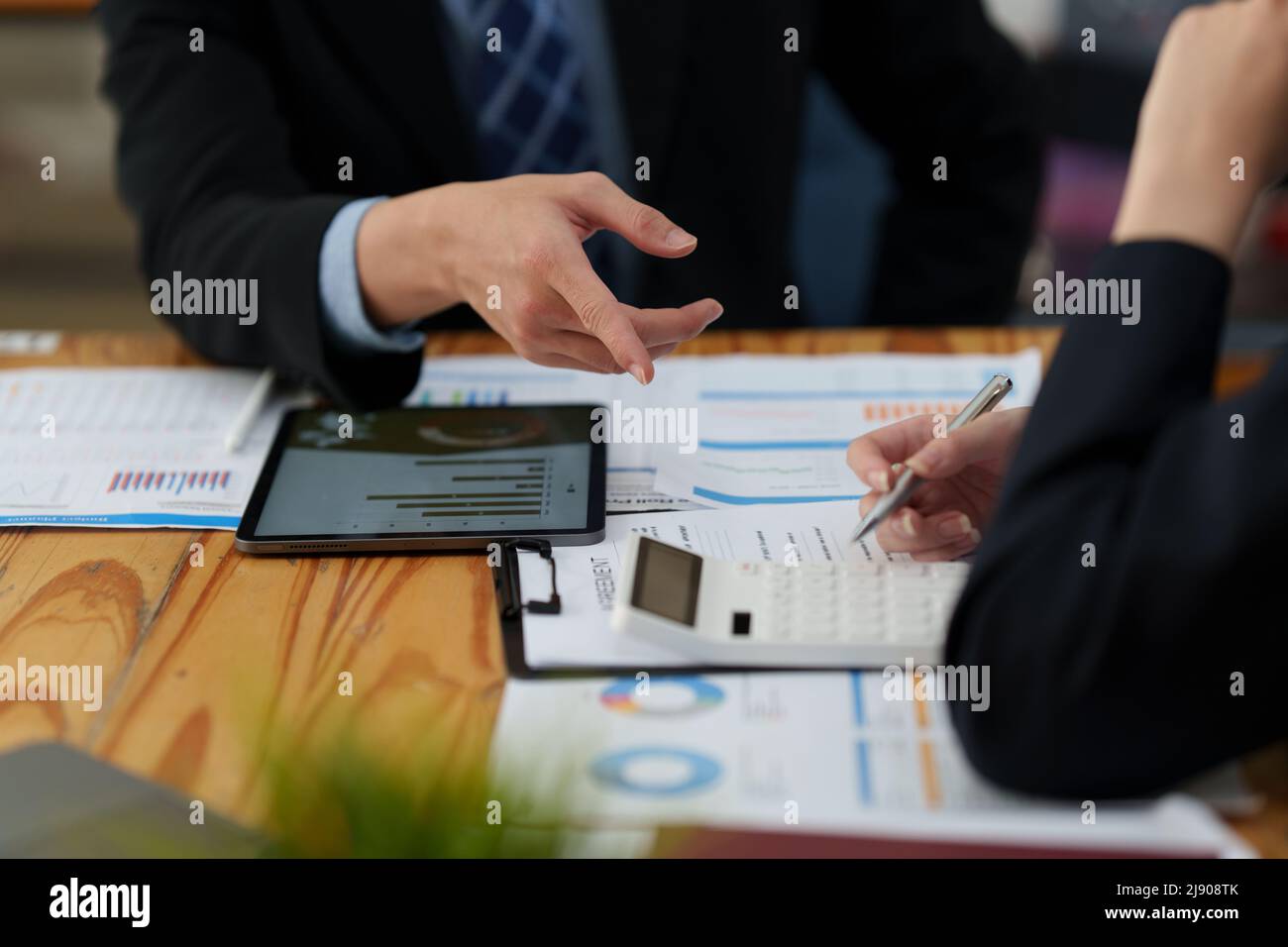 Group of Business negotiation discussing about stock market investment. Consult and meeting concept. Stock Photo