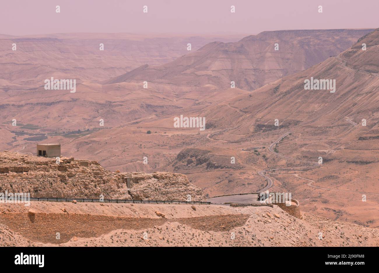 The King’s Highway Road in Jordan as it winds down through desert mountains towards Petra Stock Photo