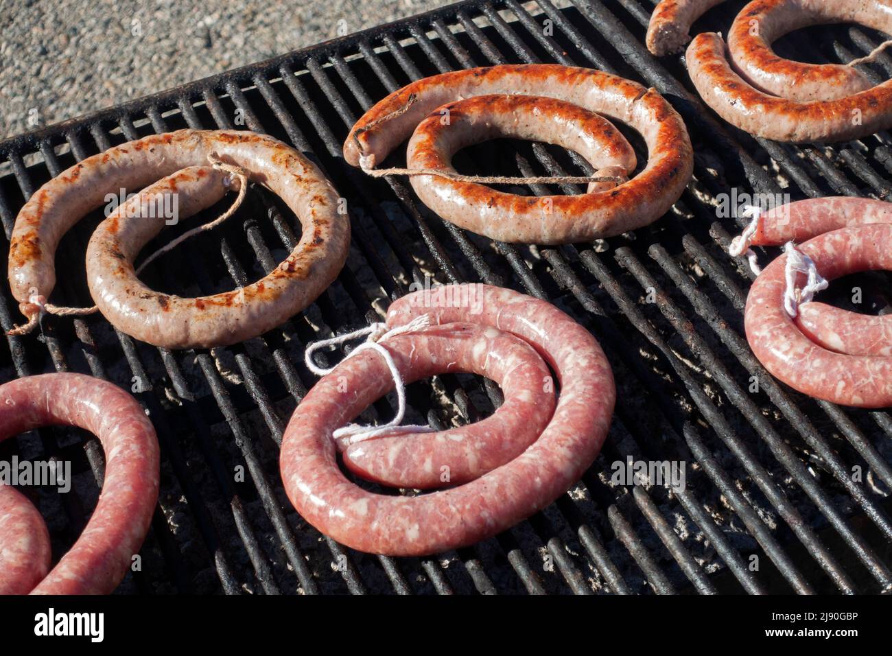 Grilling traditional sausages.Tremp festival.Catalonia.Spain Stock Photo