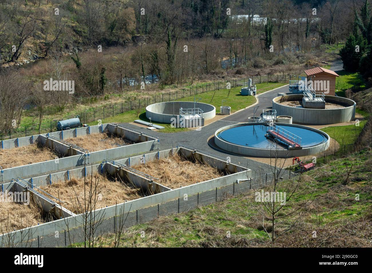 Overview of a modern wastewater treatment facility in a natural setting during daylight, Haute Loire department, Auvergne Rhone Alpes, France, Europe Stock Photo