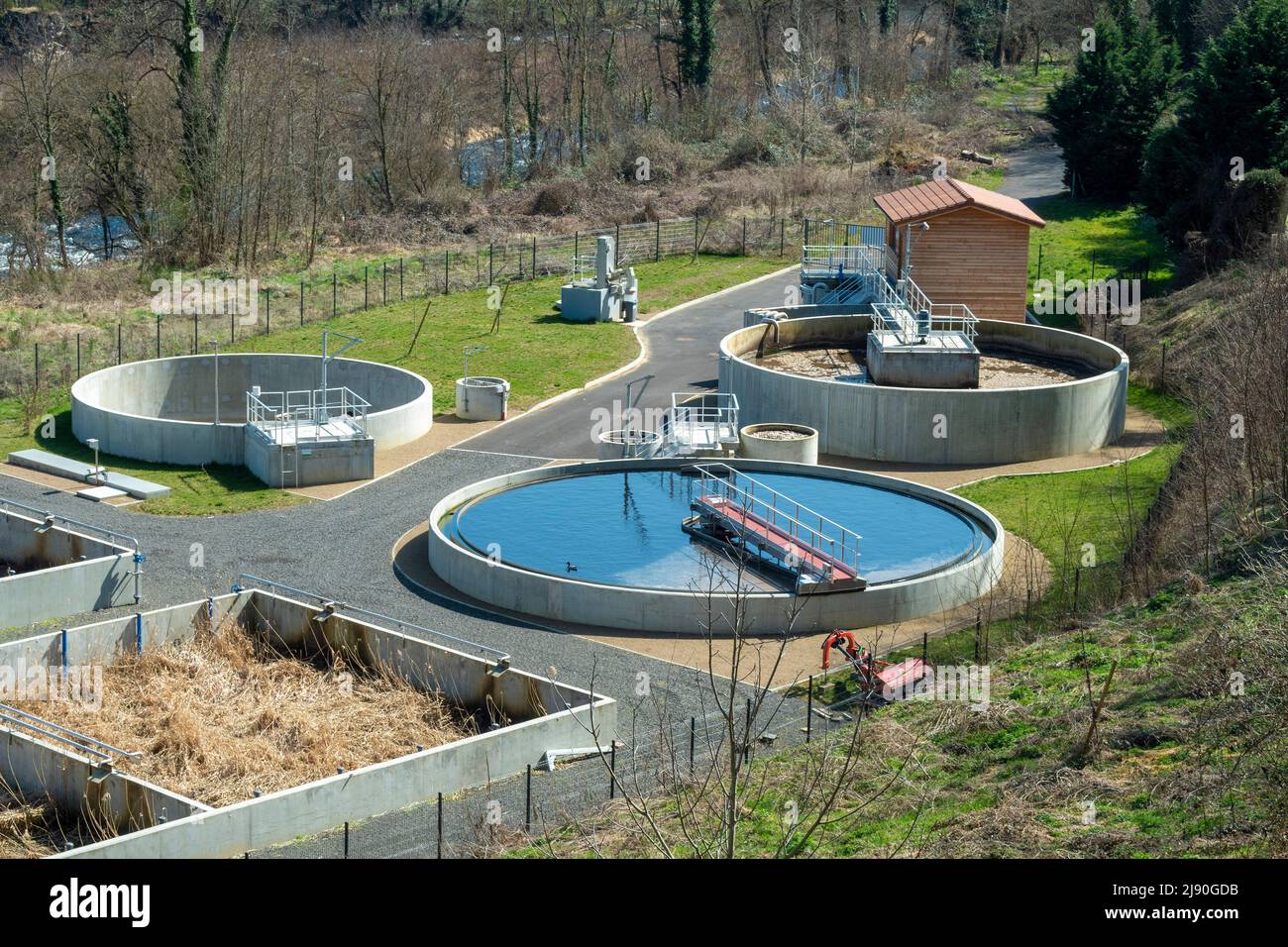 Overview of a modern wastewater treatment facility in a natural setting during daylight, Haute Loire department, Auvergne Rhone Alpes, France, Europe Stock Photo