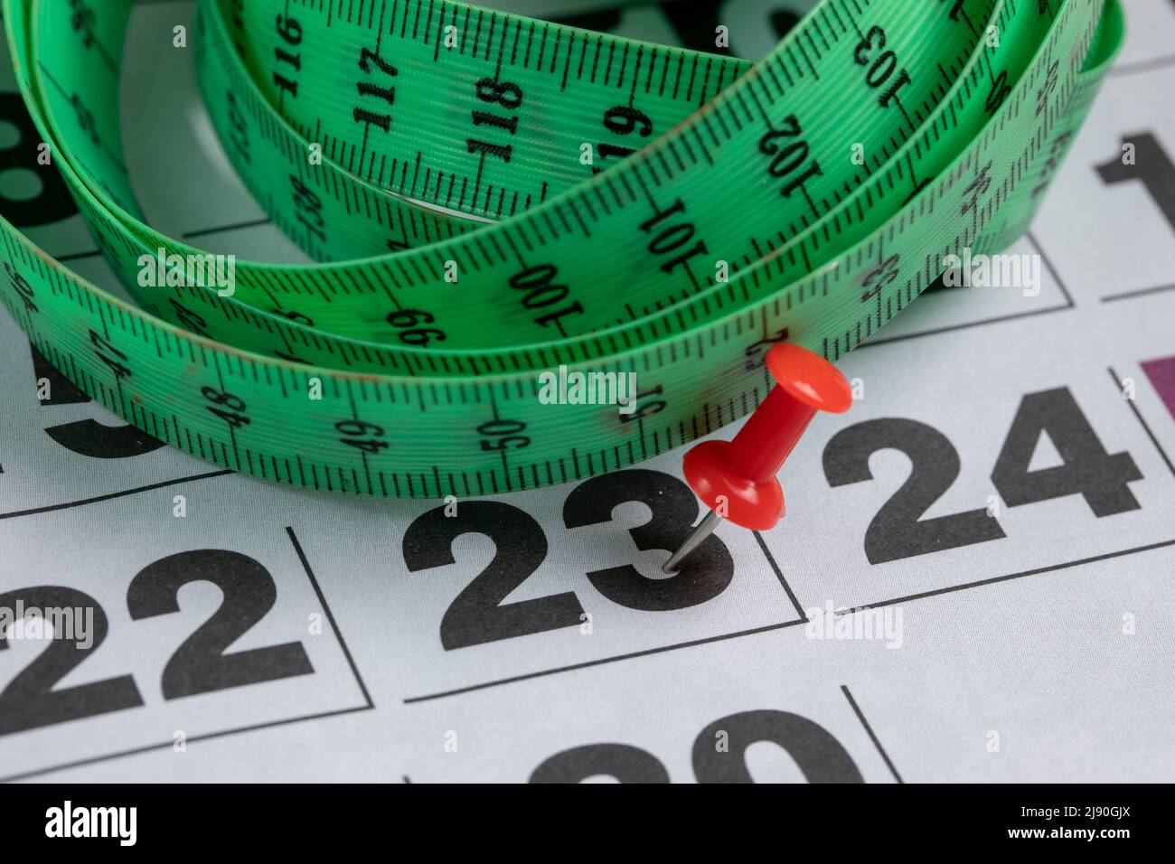 Dieting for Summer, Calendar with Measuring Tape Stock Photo