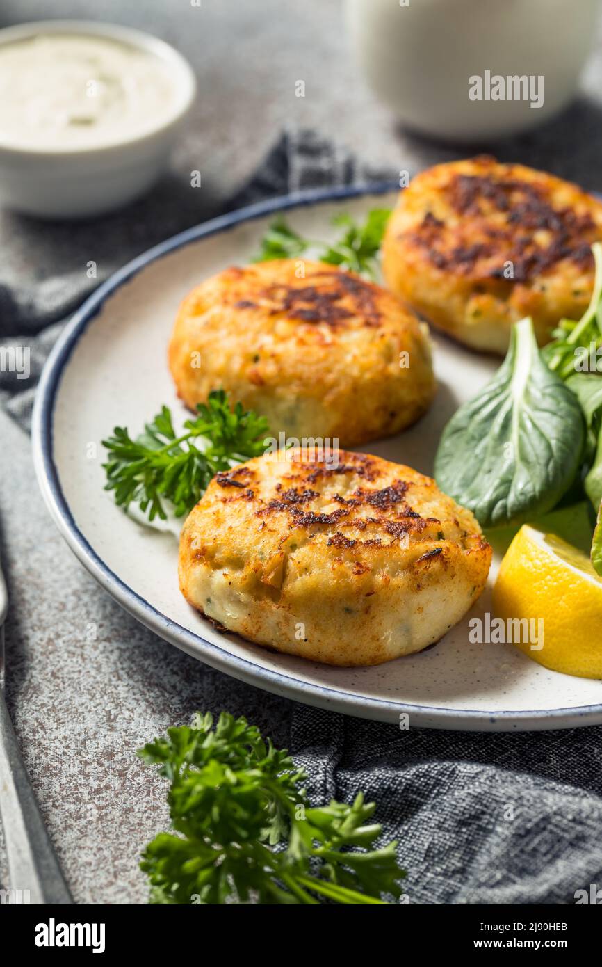 Homemade Fried Crab Cakes with Salad and Tartar Sauce Stock Photo Alamy