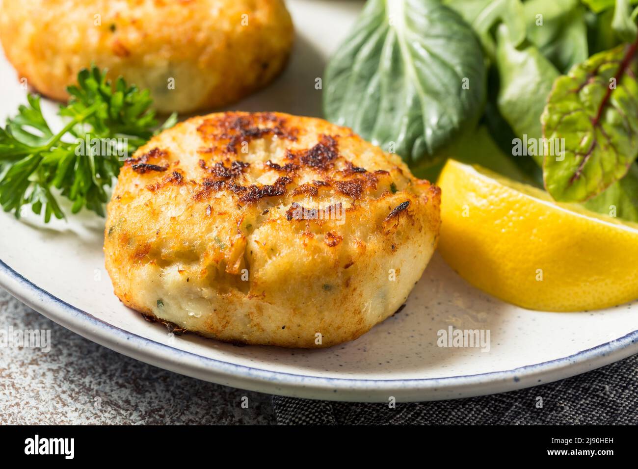 Homemade Fried Crab Cakes with Salad and Tartar Sauce Stock Photo Alamy