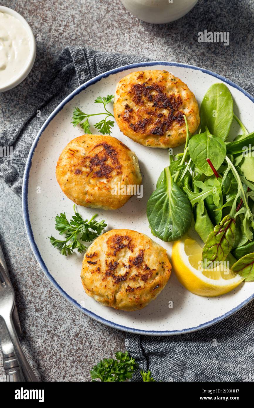 Homemade Fried Crab Cakes with Salad and Tartar Sauce Stock Photo Alamy
