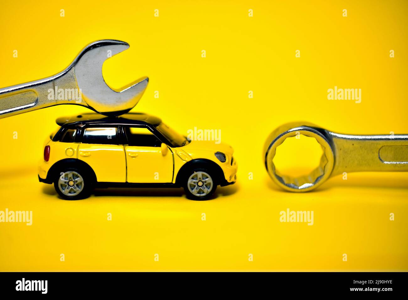 mini cooper toy car with spanner mechanic tools Stock Photo