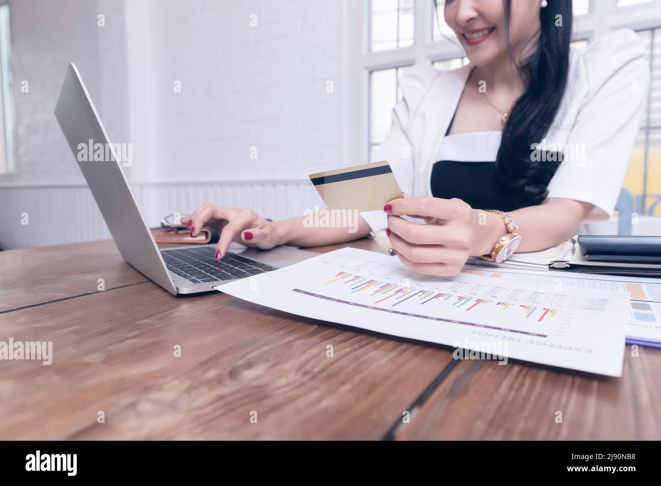 Businesswoman holding credit card and 