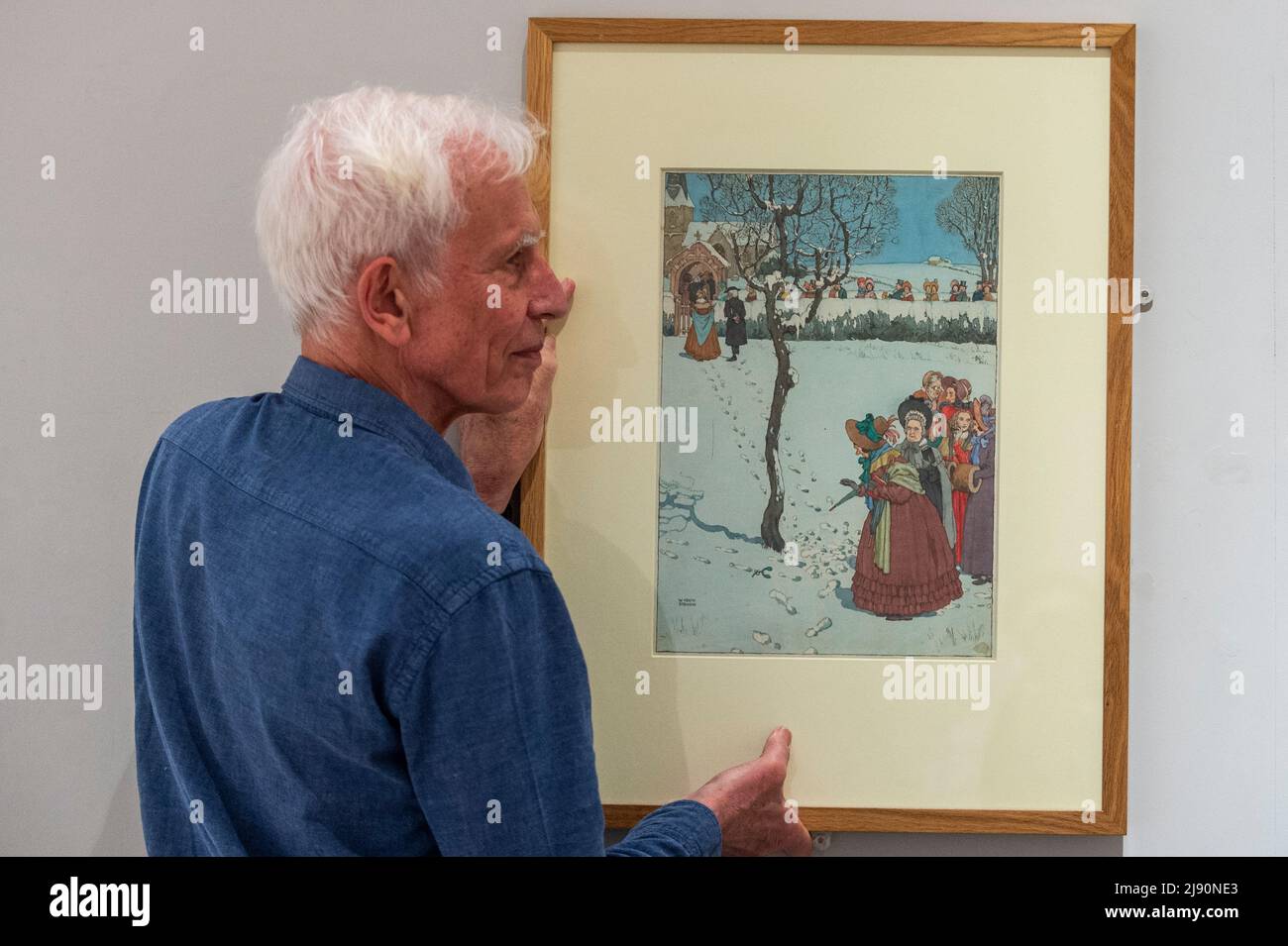 Christmas Controversy 2022 London, Uk. 19 May 2022. Geoffrey Beare, Curator, Prepares To Hang "A Christmas  Scandal", 1943, (Nb. Note The Mistletoe At The Foot Of The Tree.), By  William Heath Robinson At A Preview