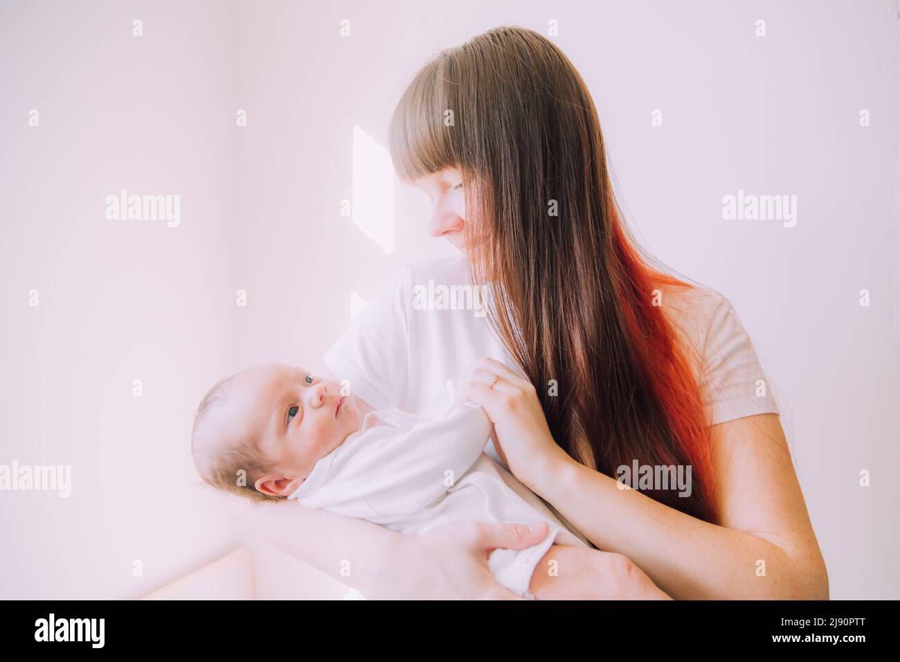 Mom holds the baby in her arms lifestyle . Mother's love for her son. A