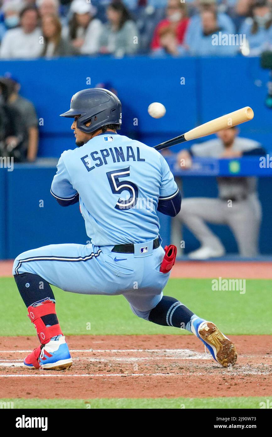 Toronto Blue Jay infielder Santiago Espinal (5) ducks at a wild pitch during an MLB game between Seattle Mariners and Toronto Blue Jays at the Rogers Stock Photo