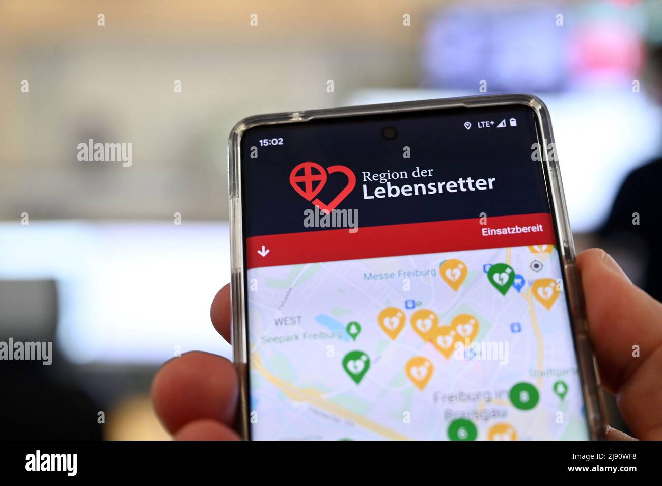 Freiburg, Germany. 19th May, 2022. The Freiburg Breisgau-Hochschwarzwald Integrated Control Center is showing a smartphone app designed to help victims of cardiac arrest as quickly as possible. First responders are to be better networked with it. In Baden-Württemberg, they are alerted statewide via the app in the event of an emergency in the vicinity - i.e. even if they are currently far away from their actual area of operation. Credit: Uli Deck/dpa/Alamy Live News Stock Photo
