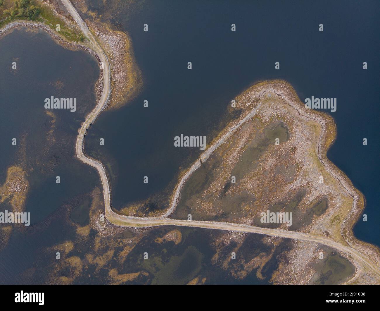 Stone dam-road on Solovki. Road through the White Sea. Big Muksalma Island. Russia, Arkhangelsk region Stock Photo