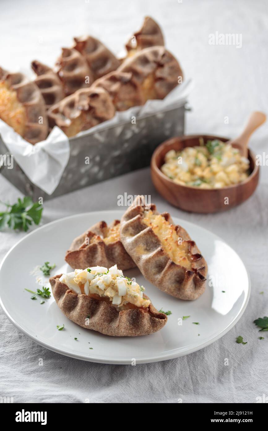 Traditional Finnish pastry - Karelian rye pie with rice porridge and an ...