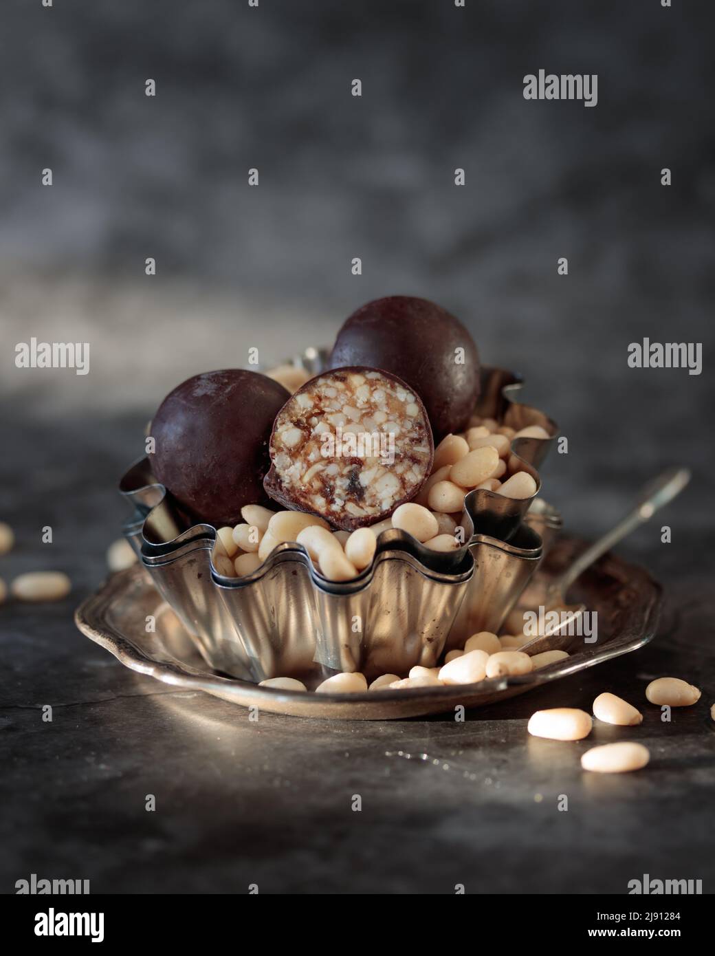 Pine nut candies with a chocolate vertical Stock Photo Alamy