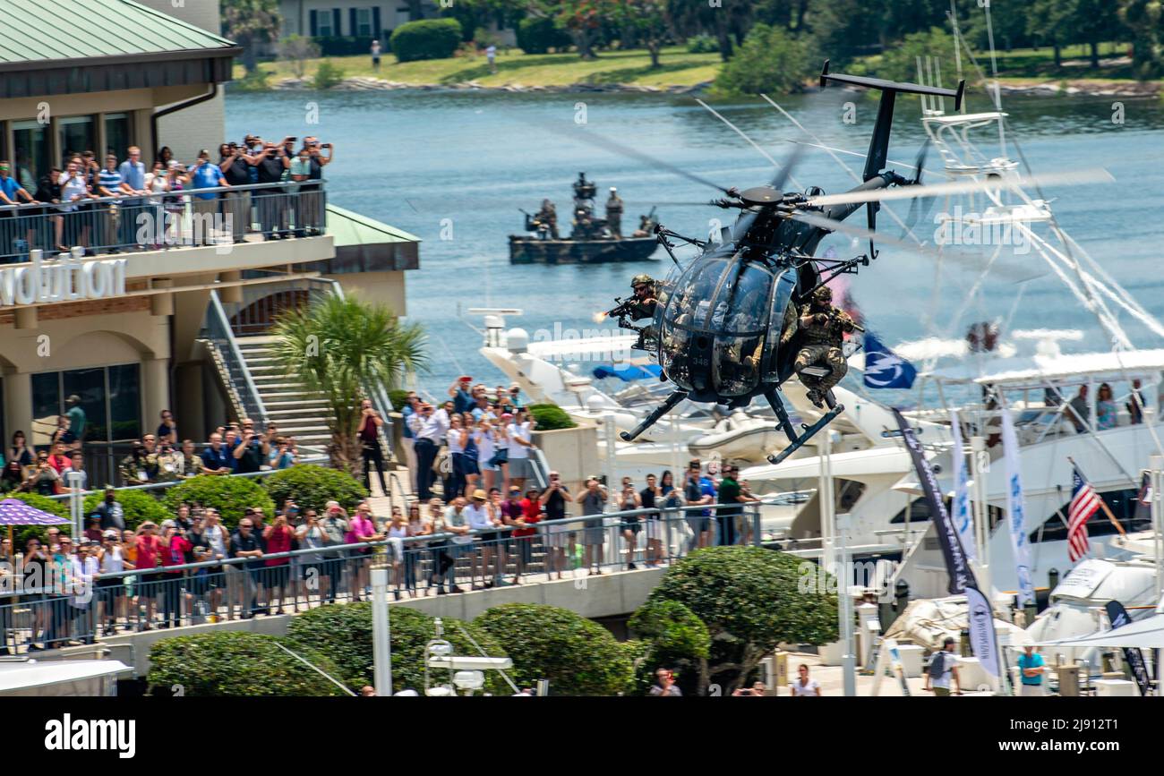 Tampa, United States. 18th May, 2022. U.S. Special Operations Forces commandos perform an attack maneuver in an Army MH-6 helicopter during a public demonstration as part of SOF Week, May 18, 2022 in Tampa, Florida. Credit: SSgt. Alexander Cook/U.S. Air Force/Alamy Live News Stock Photo