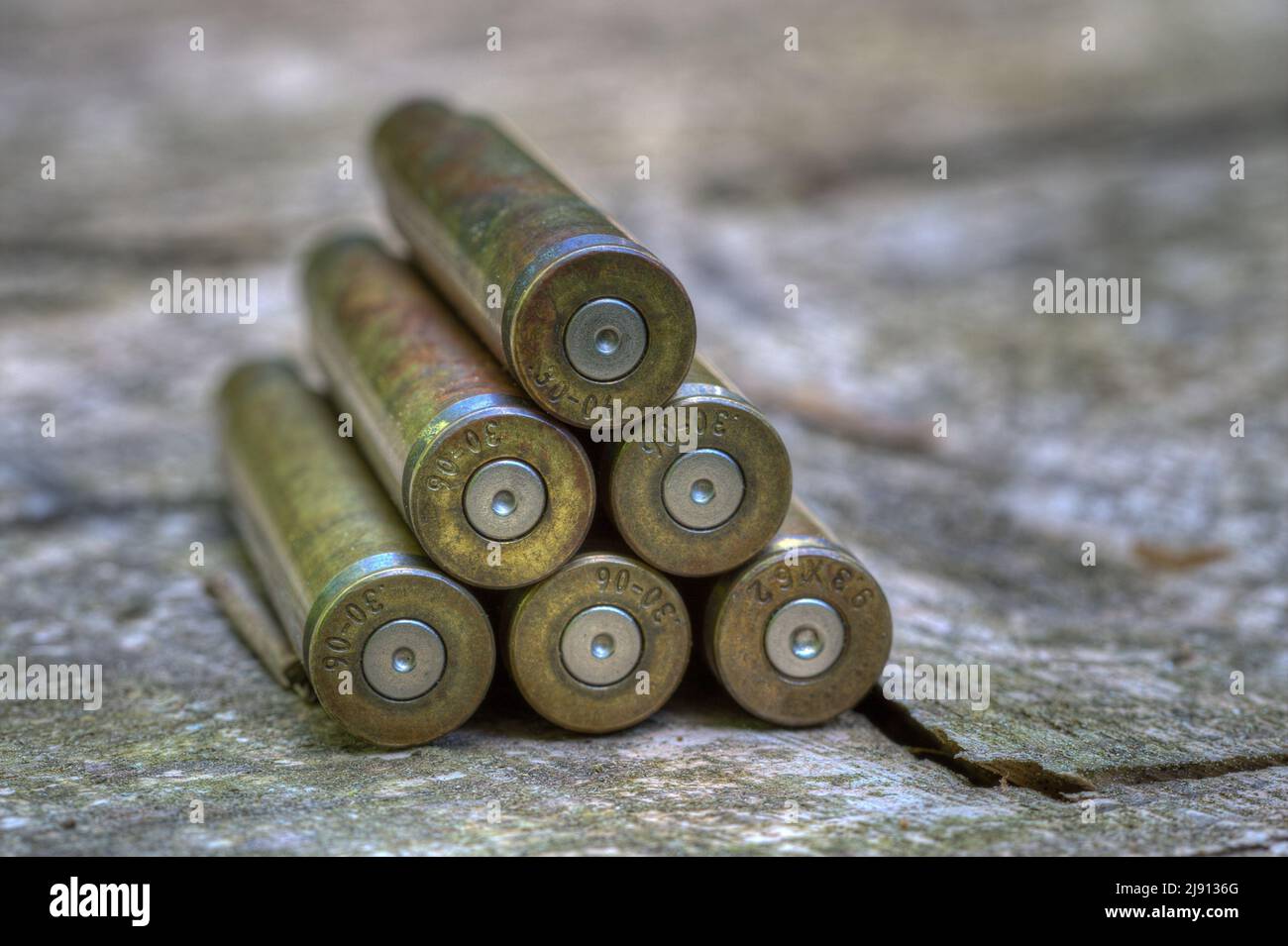 At the end of the hunting season, the empty shell casings lying stacked to a small pyramid on the wooden board of the hunting pulpit. Stock Photo