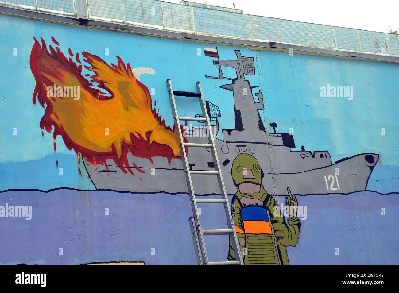 ZAPORIZHZHIA, UKRAINE - MAY 19, 2022 - A mural by street artist Denys Antiukov inspired by the Russian Warship, Go F... Yourself! postage stamp is pic Stock Photo