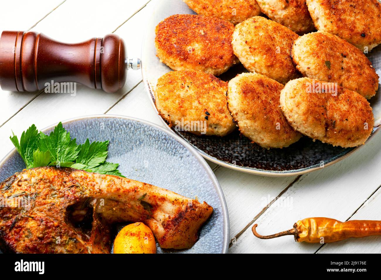 Homemade minced fish cutlets and fish steak Stock Photo