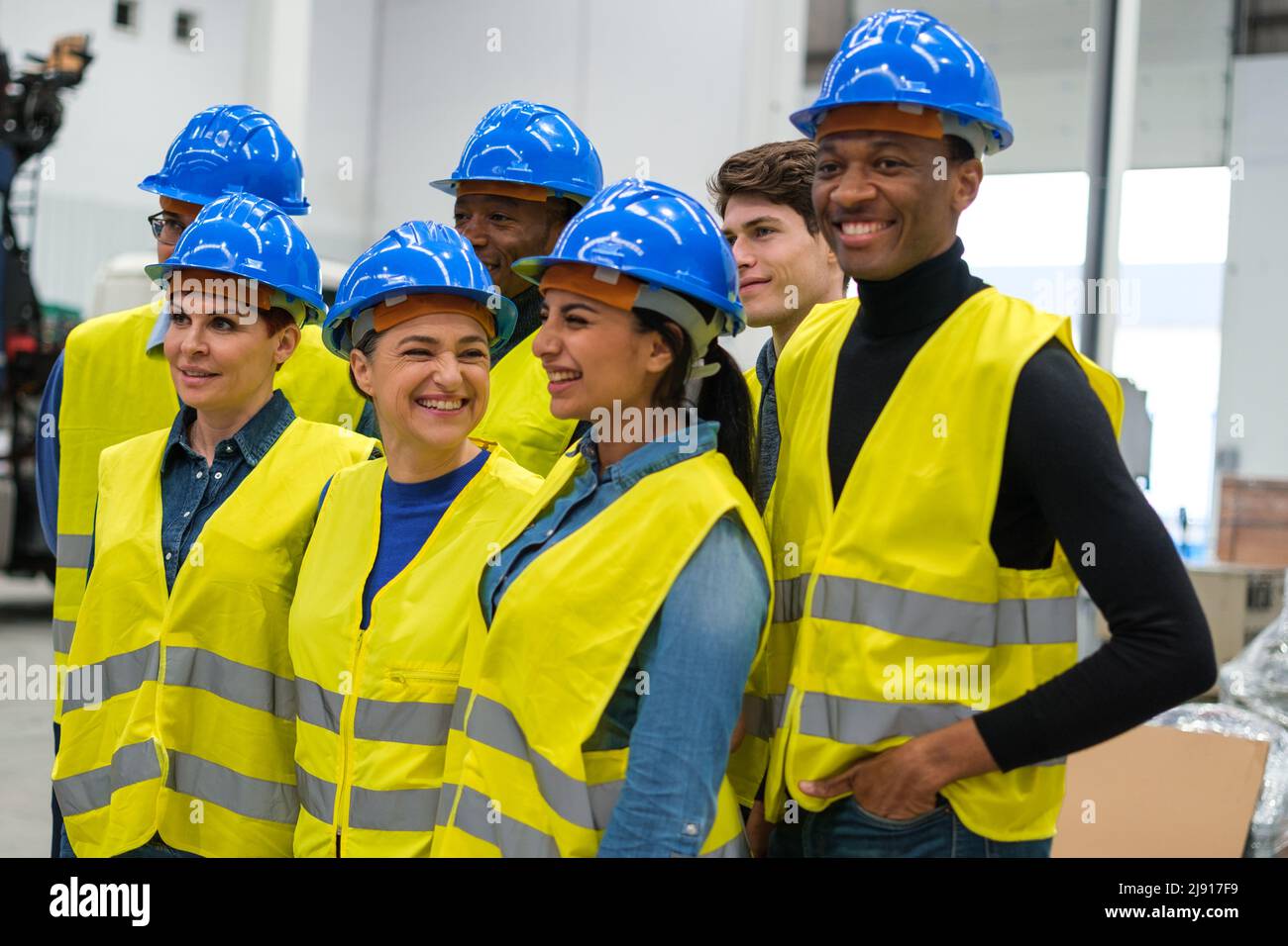 Side view photo of group of engineers in factory Stock Photo Alamy