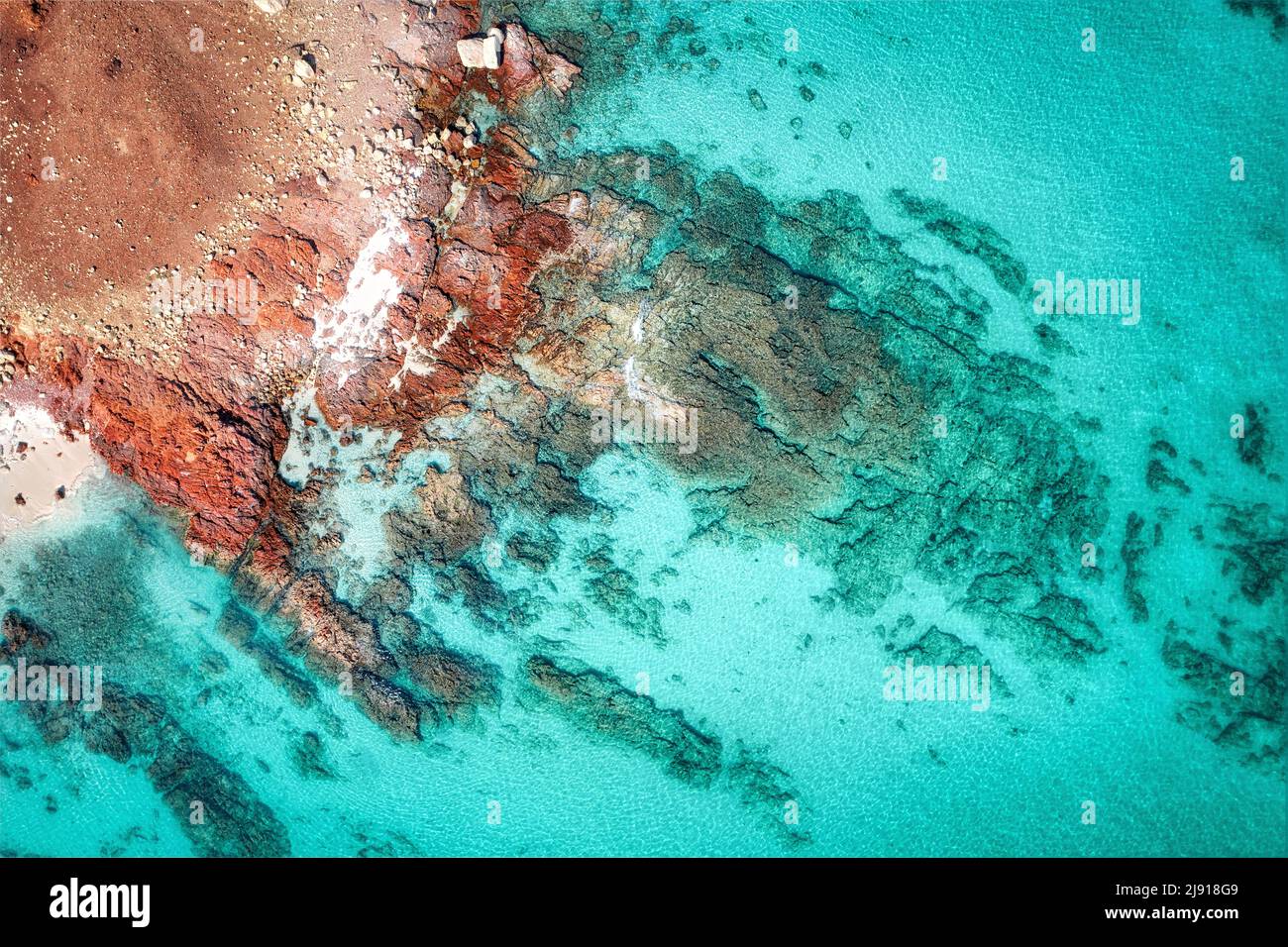 Rocky shoreline with turquoise water on Socotra, Yemen, taken in November 2021, post processed using exposure bracketing Stock Photo