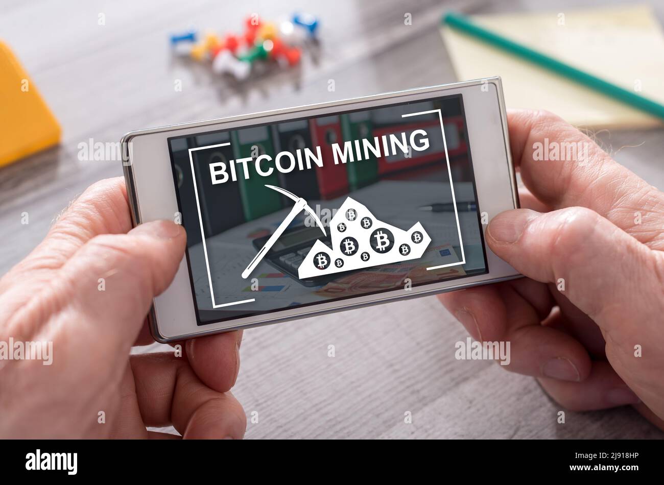 Bitcoin mining concept on mobile phone Stock Photo - Alamy