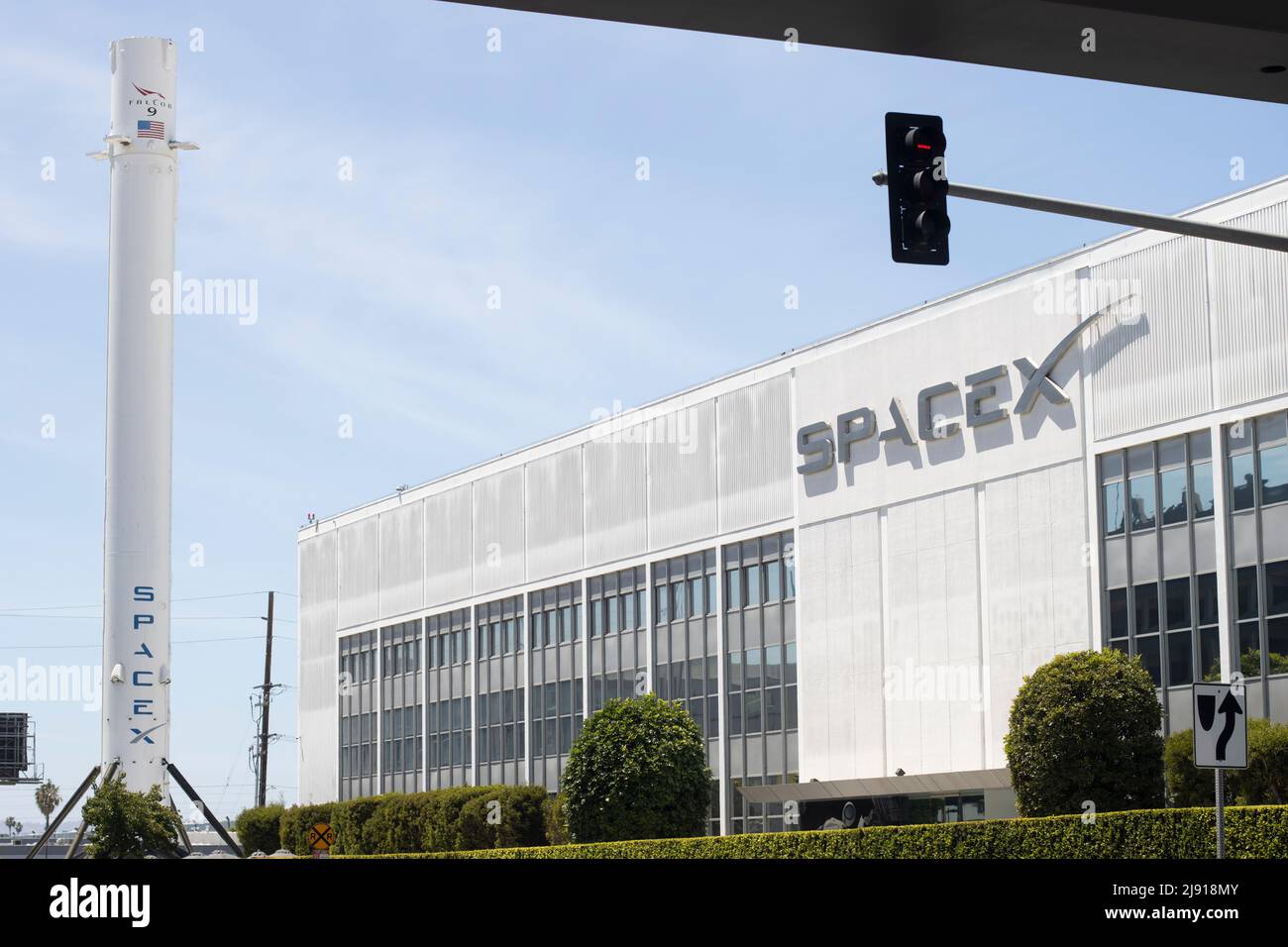 Exterior view of the SpaceX headquarters with recovered Falcon 9 rocket booster on display in Hawthorne, California, seen on Tuesday, May 10, 2022. Stock Photo