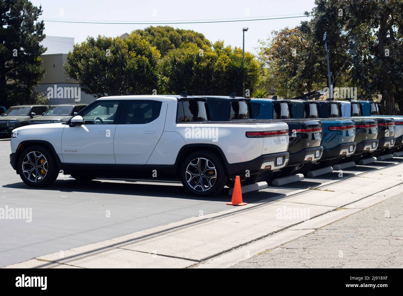 New Rivian R1T trucks are seen at a Rivian service center in South San Francisco, California, on May 1, 2022. Stock Photo