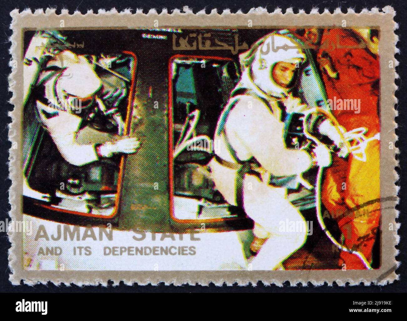 AJMAN - CIRCA 1973: a stamp printed in the Ajman shows Astronauts and Command Module, Space Exploration Program, Apollo, circa 1973 Stock Photo