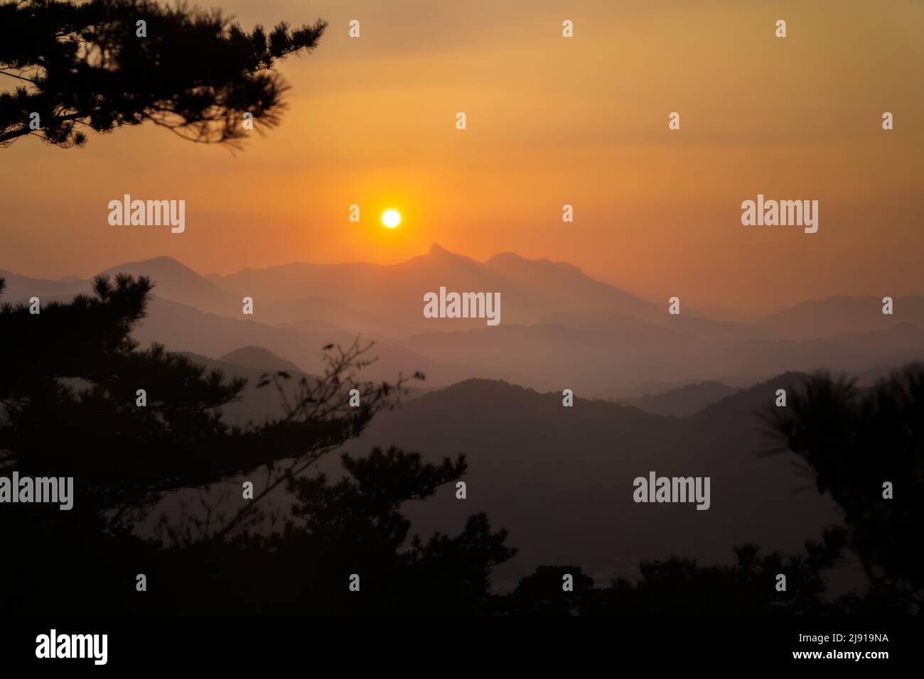 Sunset over the mountains in Woraksan National Park, South Korea, taken in November 2021, post processed using exposure bracketing Stock Photo