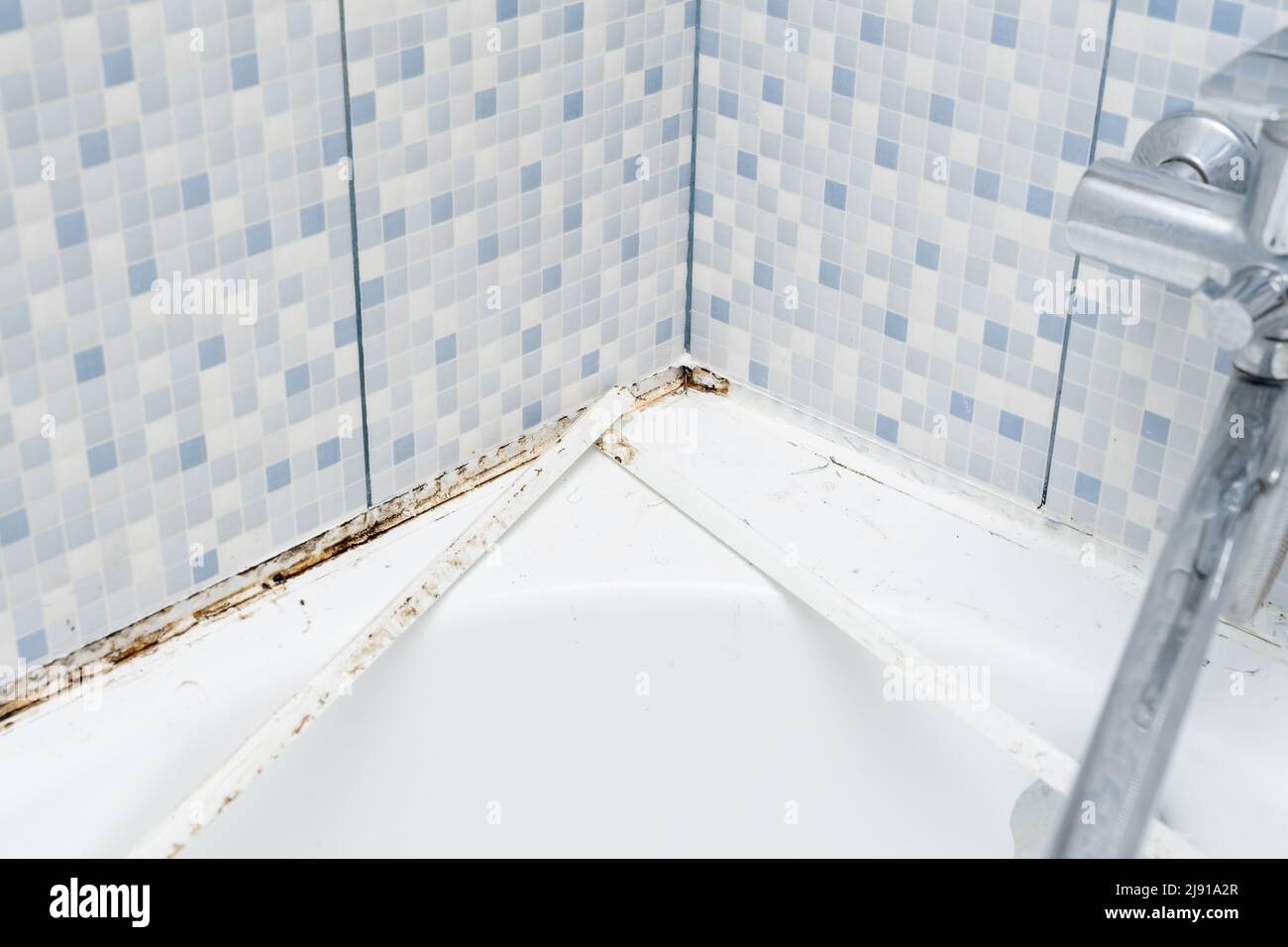 Mould on tiles in a bathroom. problem in bath areas and shower Stock