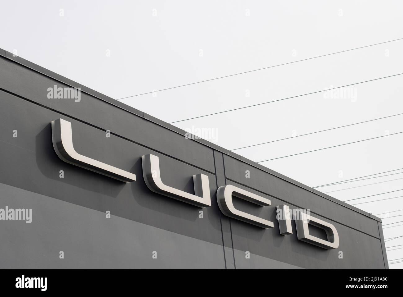 Closeup of the Lucid logo seen at a Lucid showroom in Millbrae, California, on May 5, 2022. Lucid Group Inc. is an American electric vehicle manufacturer. Stock Photo