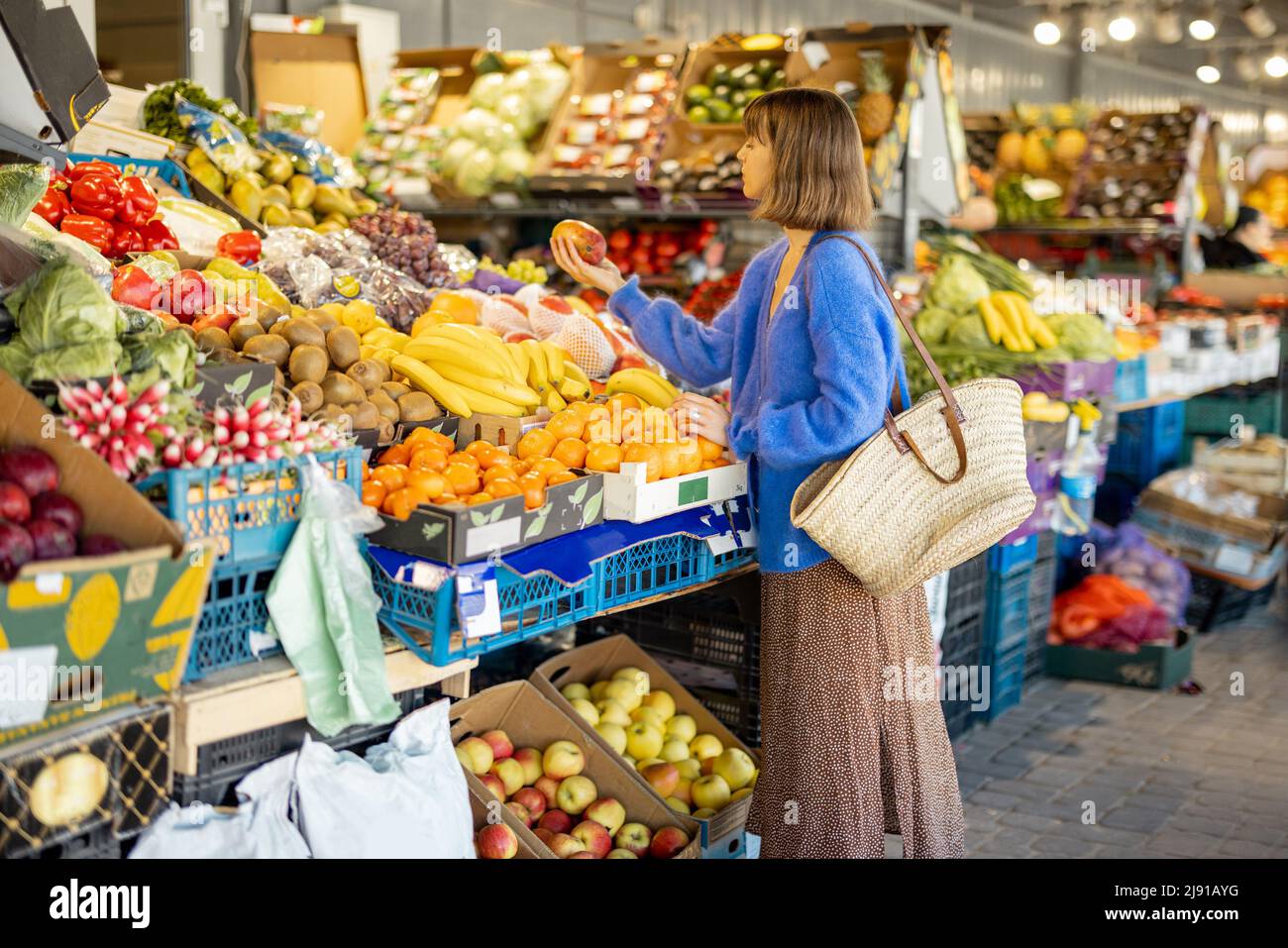 Woman shopping food at market Stock Photo