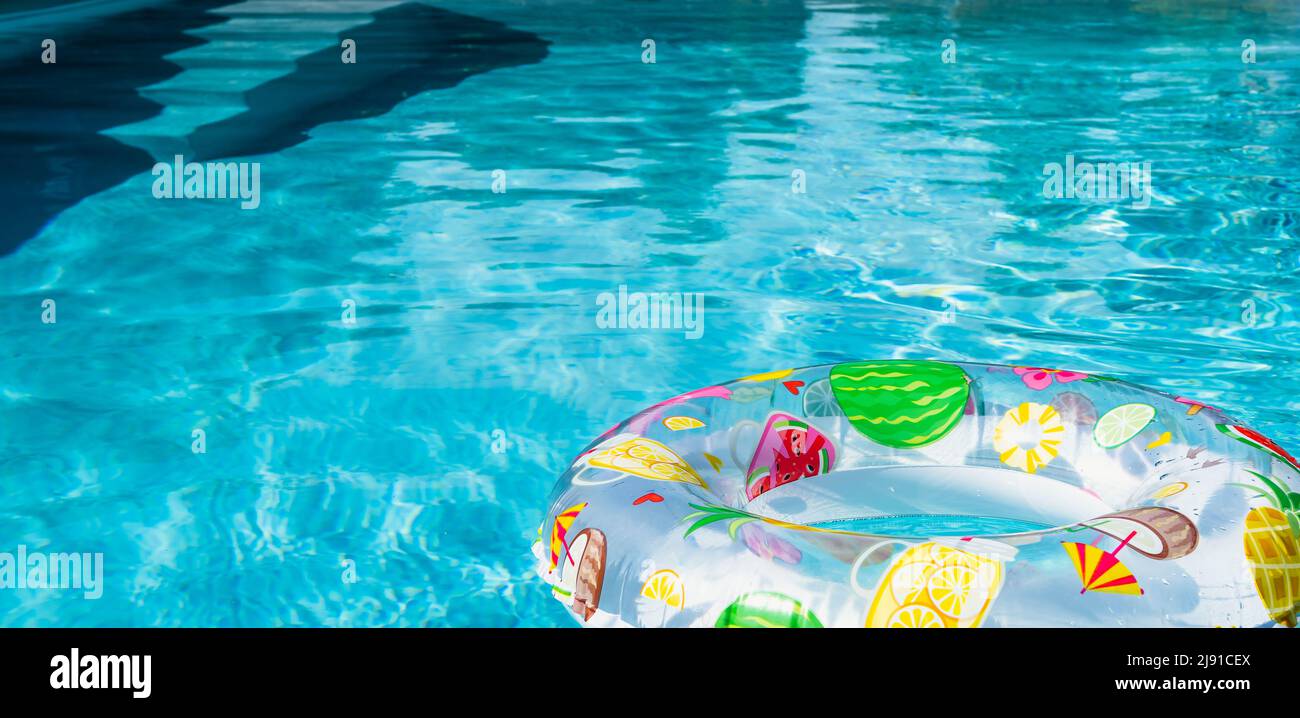 Summer swimming pool concept with floating ring in the pool. Stock Photo