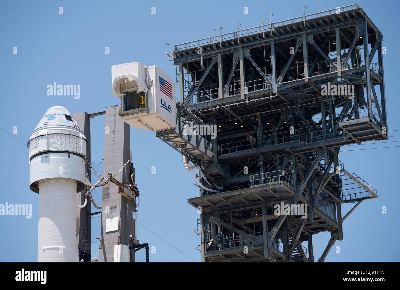 Cape Canaveral, United States of America. 18 May, 2022. The crew access arm attached to the United Launch Alliance Atlas V rocket carrying the Boeing CST-100 Starliner spacecraft aboard at Space Launch Complex 41 as it prepares for launch, May 18, 2022 in Cape Canaveral, Florida. The Orbital Flight Test-2 will be second un-crewed flight test and will dock to the International Space Station and is expected to lift off May 19th. Credit: Joel Kowsky/NASA/Alamy Live News Stock Photo