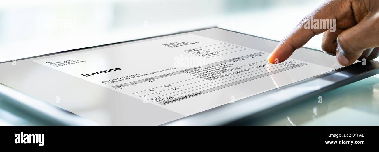 Accountant Using E Invoice Software On Tablet Stock Photo