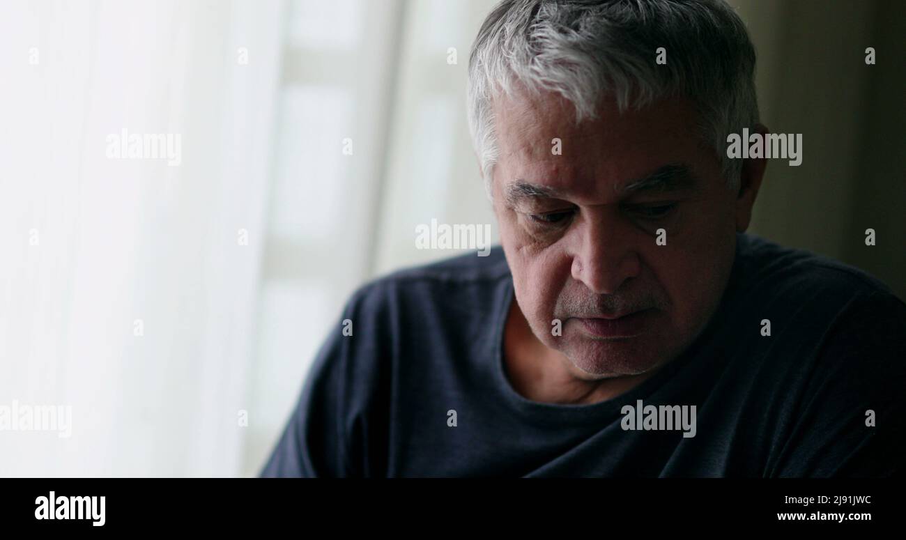 Attractive senior man thinking hi-res stock photography and images - Alamy