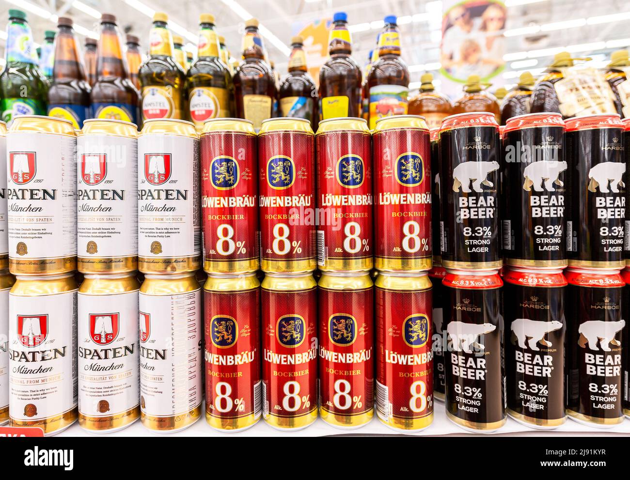 Samara, Russia - May 8, 2022: Different alcoholic canned beer in metal cans on the shelf in a superstore. Various alcoholic beverages and spirit drink Stock Photo