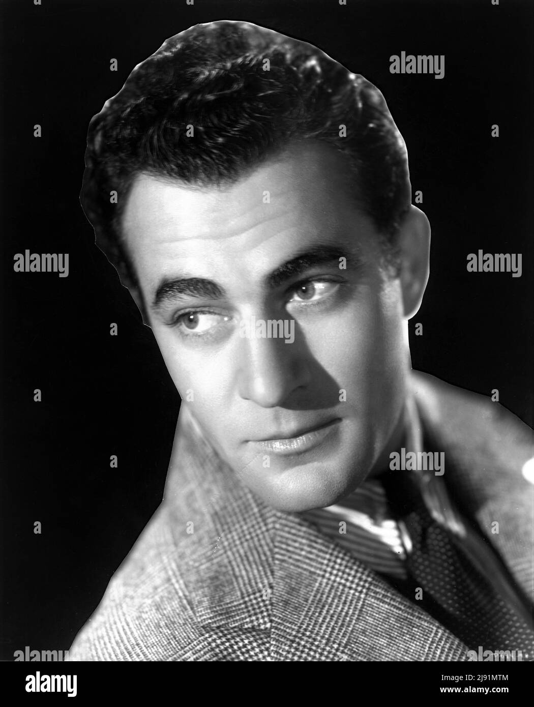 GILBERT ROLAND Portrait as gigolo Pepi D'Costa in OUR BETTERS 1933 director GEORGE CUKOR play W. Somerset Maugham RKO Radio Pictures Stock Photo