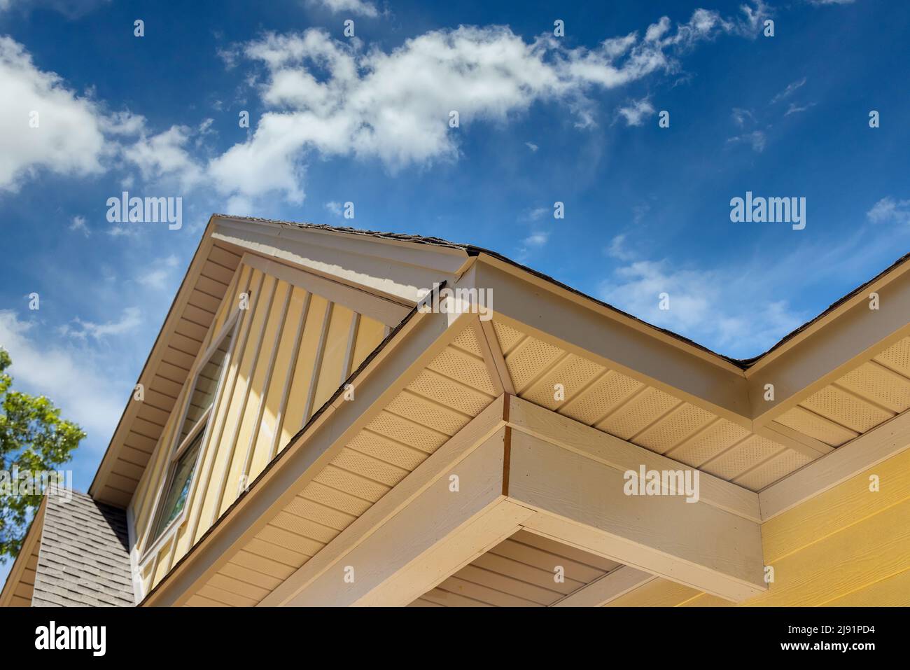 Roof shingles in top the on new home under construction site Stock Photo