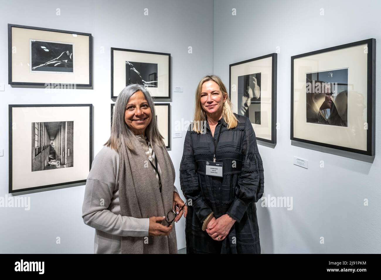 New York, USA. 19th May, 2022. Argentine art gallery Vasari's directors Marina Pellegrini (L) and Lauren Bate pose in front of original silver print photographs by AnneMarie Heinrich during the opening day of The Photography Show presented by AIPAD (Association of International Photography Art Dealers) in New York City. The show brings together 49 of the world's leading galleries of fine art photography. Credit: Enrique Shore/Alamy Live News Stock Photo