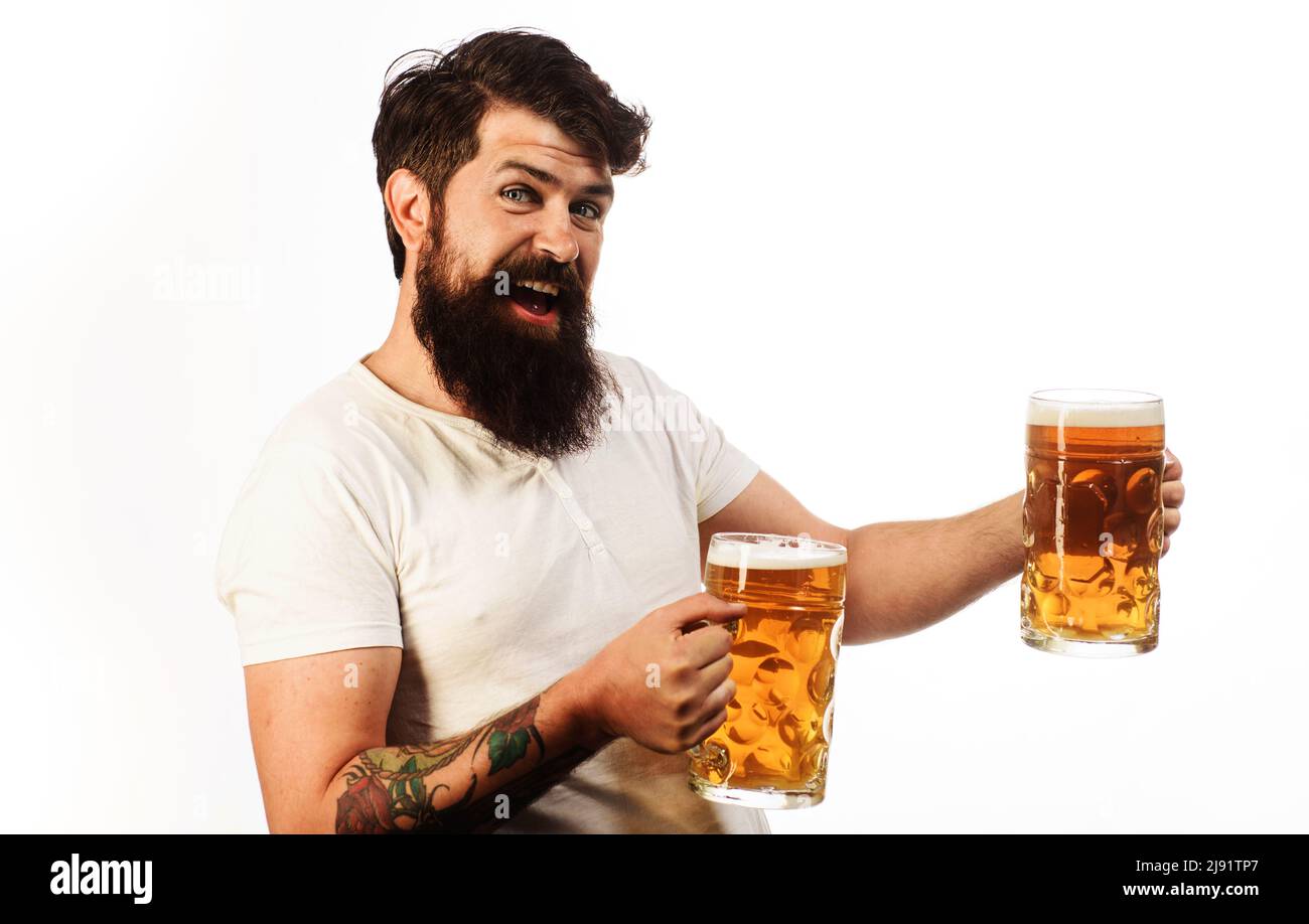 Happy bearded man drinking beer from mug. Brewing. Oktoberfest. Alcohol. Good taste, happy mood Stock Photo