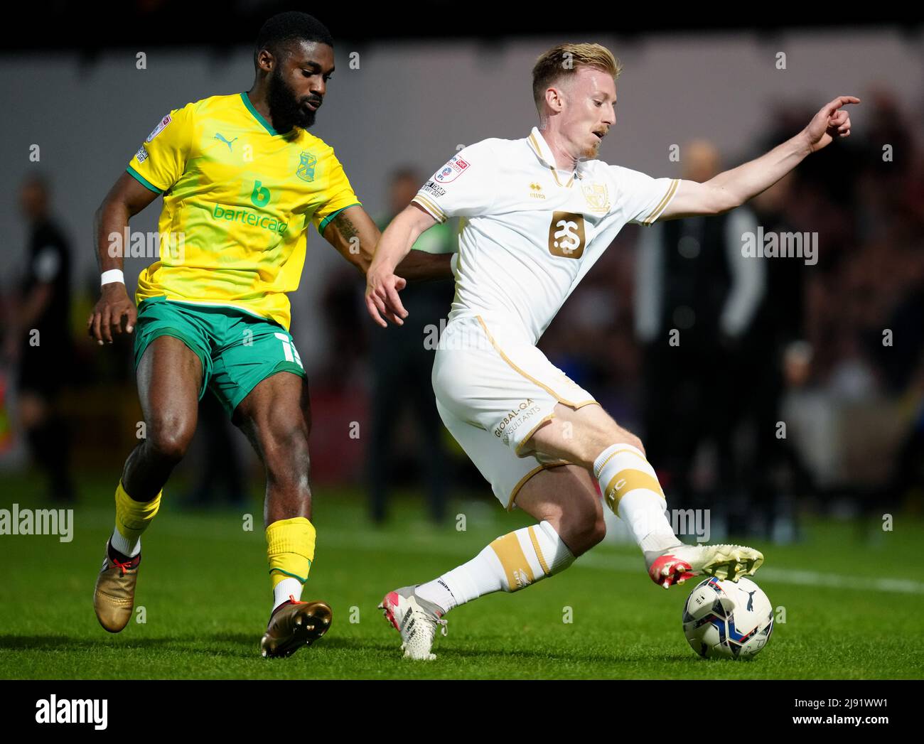 Port Vale's Harry Charsley (right) evades Swindon Town's Mandala Egbo during the Sky Bet League Two play-off semi-final, second leg match at Vale Park, Stoke-on-Trent. Picture date: Thursday May 19, 2022. Stock Photo
