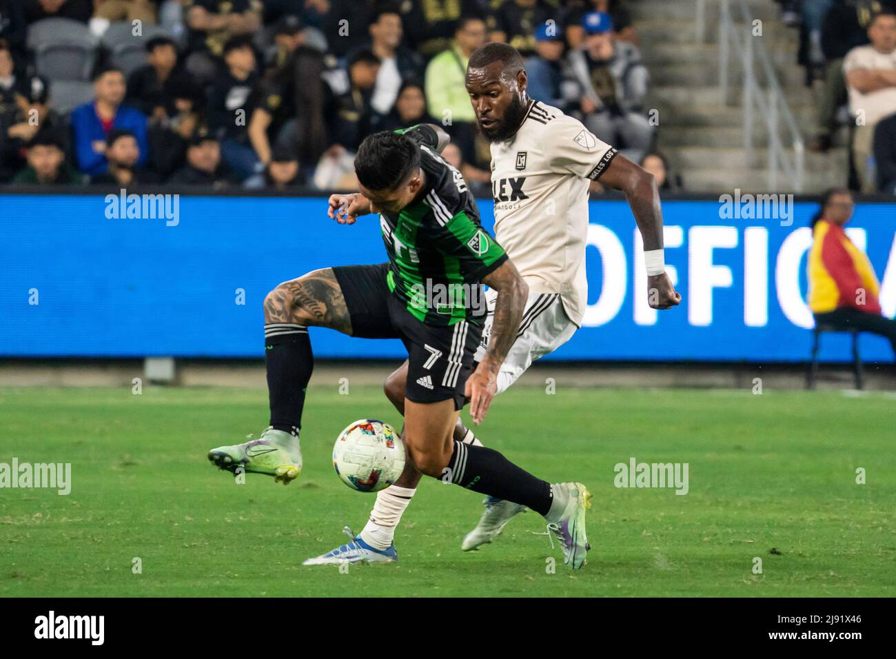 Austin FC forward Sebastián Driussi (7) is defended by LAFC defender Sebastien Ibeagha (25) during a MLS match, Wednesday, May 18, 2022, at the Banc o Stock Photo