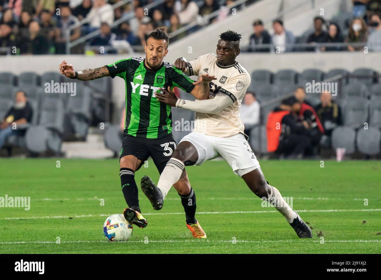 Los Angeles, United States. 18th May, 2022. LAFC defender Jesús Murillo (3)  fouls Austin FC forward Maximiliano Urruti (37) during a MLS match,  Wednesday, May 18, 2022, at the Banc of California