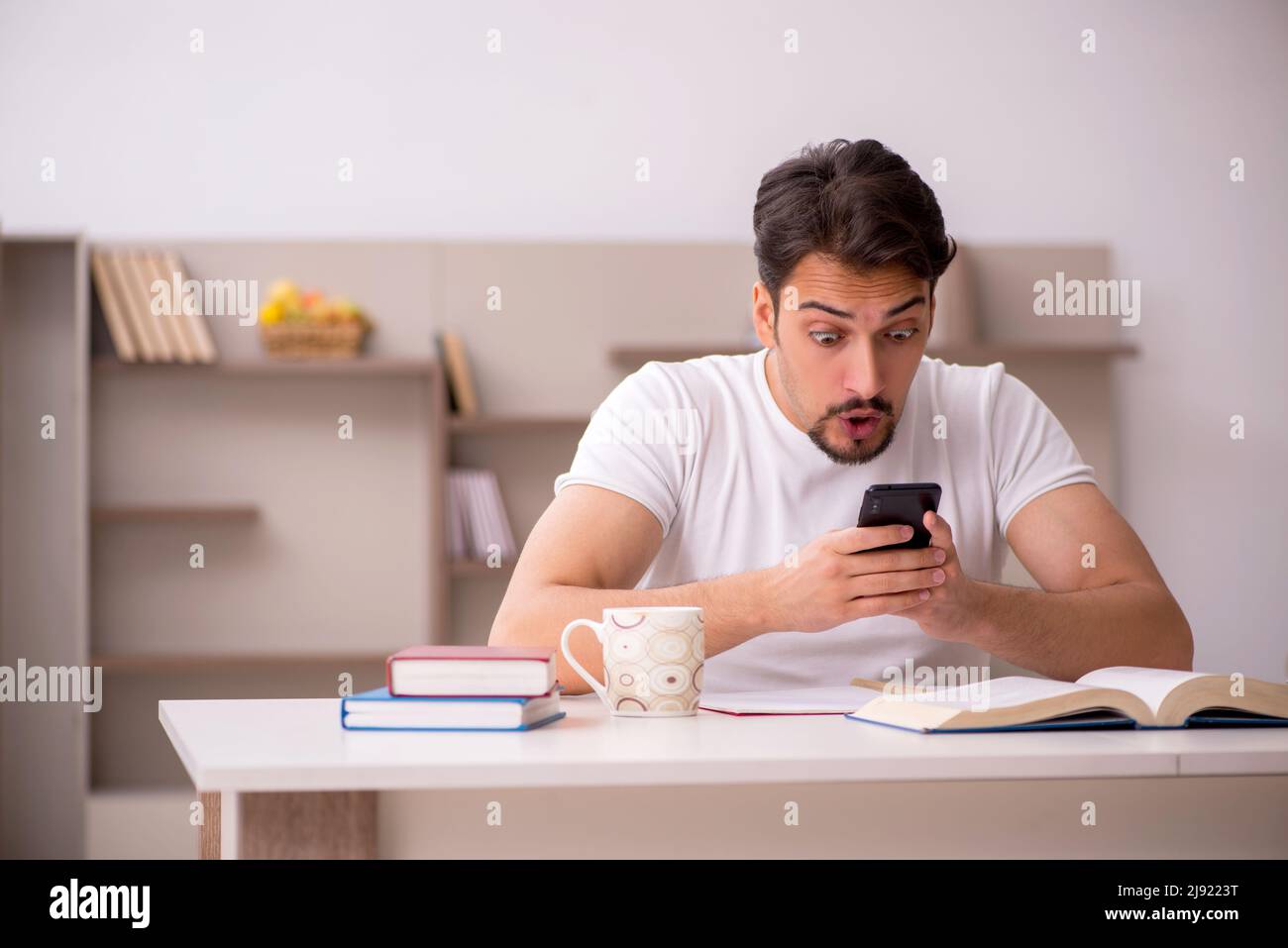 Young student studying at home during pandemic Stock Photo - Alamy